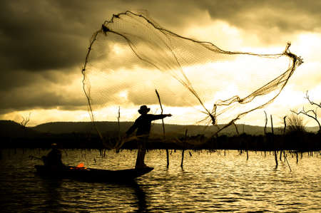 fisher man on the boat の写真素材