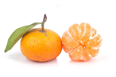 ripe orange with leaves on white backgroundの写真素材