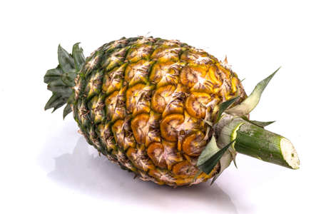 Pineapple with slices on white backgroundの写真素材