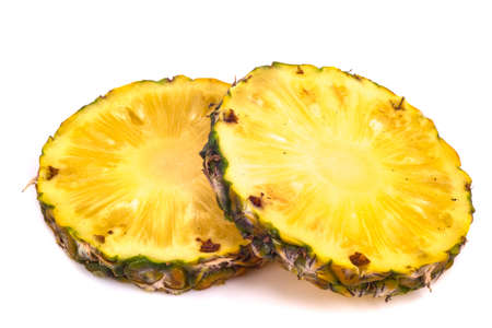 Pineapple with slices on white backgroundの写真素材