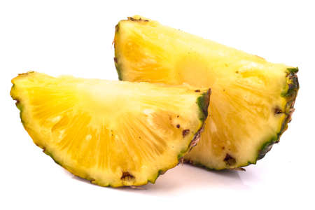 Pineapple with slices on white backgroundの写真素材