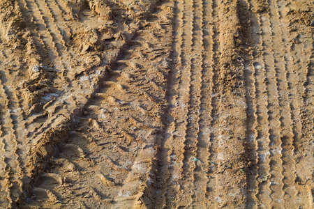 Tire track on muddy roadの写真素材
