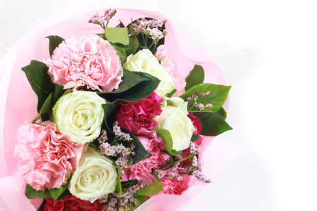 flower bouquet in basket isolated white backgroundの写真素材