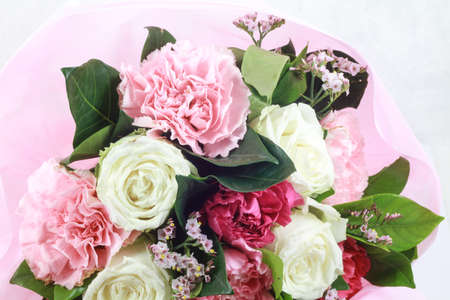 flower bouquet in basket isolated white backgroundの写真素材