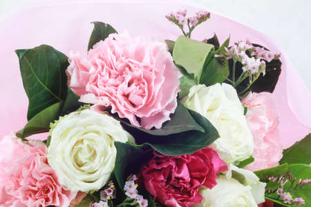 flower bouquet in basket isolated white backgroundの写真素材