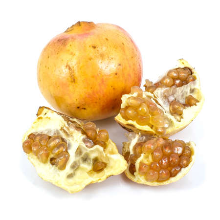 yellow pomegranate and its half  Isolated on a white background.の写真素材