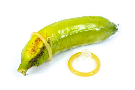 condom and banana in white backgroundの写真素材