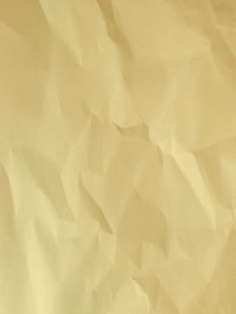 yellow wrinkled paper texture backgroundの写真素材