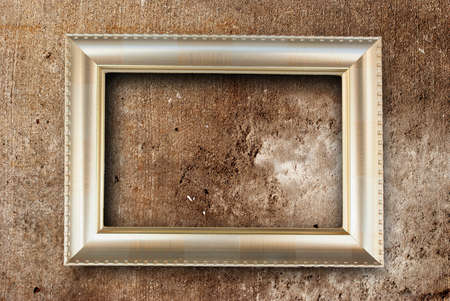 gold picture frame and on concrete backgroundの写真素材