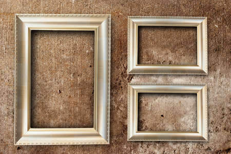 gold picture frame and on concrete backgroundの写真素材