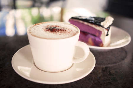 cup of coffee and cake close up の写真素材