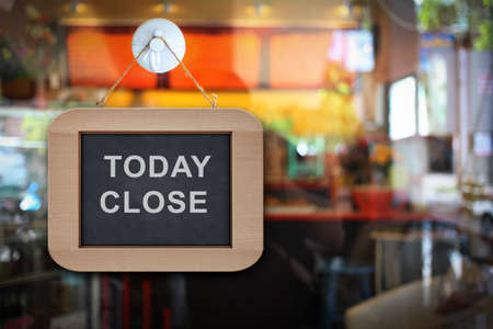  the banner sign hang on the door in coffee shopの写真素材