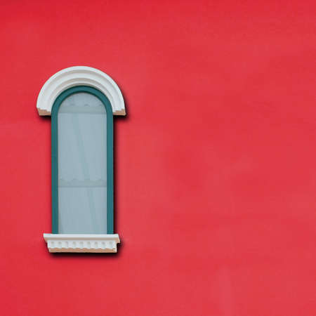 vintage windows on the red wallの写真素材