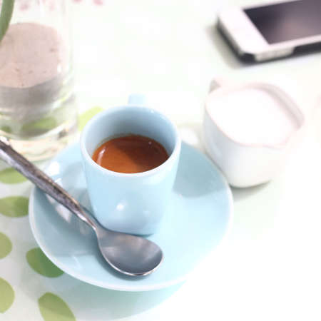 cup of coffee on the desk in coffee shopの写真素材