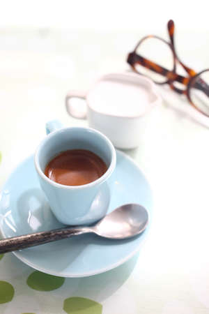 cup of coffee on the desk in coffee shopの写真素材