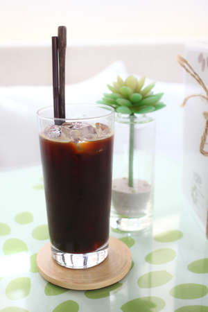 cup of coffee on the desk in coffee shopの写真素材