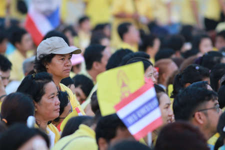 BANGKOK ,THAILAND - DECEMBER 5: Unidentified Hundreds of thousands of people thronged the Royal Plaza to help celebrate HM's 85th birthday; the King is the world's longest-reigning monarch. His Majesty ended his birthday speech delivered to all well-wisheのeditorial素材