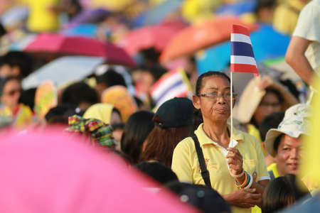 BANGKOK ,THAILAND - DECEMBER 5: Unidentified Hundreds of thousands of people thronged the Royal Plaza to help celebrate HM's 85th birthday; the King is the world's longest-reigning monarch. His Majesty ended his birthday speech delivered to all well-wisheのeditorial素材