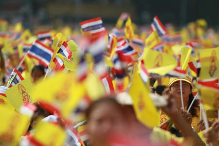 BANGKOK ,THAILAND - DECEMBER 5: Unidentified Hundreds of thousands of people thronged the Royal Plaza to help celebrate HM's 85th birthday; the King is the world's longest-reigning monarch. His Majesty ended his birthday speech delivered to all well-wisheのeditorial素材