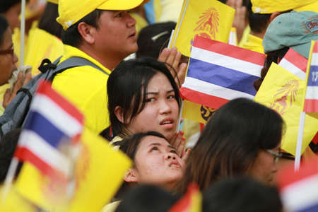 BANGKOK ,THAILAND - DECEMBER 5: Unidentified Hundreds of thousands of people thronged the Royal Plaza to help celebrate HM's 85th birthday; the King is the world's longest-reigning monarch. His Majesty ended his birthday speech delivered to all well-wisheのeditorial素材