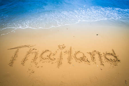 Thailand  written in a sandy tropical beachの写真素材