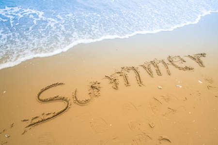 Summer  written in a sandy tropical beachの写真素材