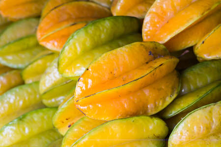 Fresh star fruit on display from fruit and vegetable market.の写真素材