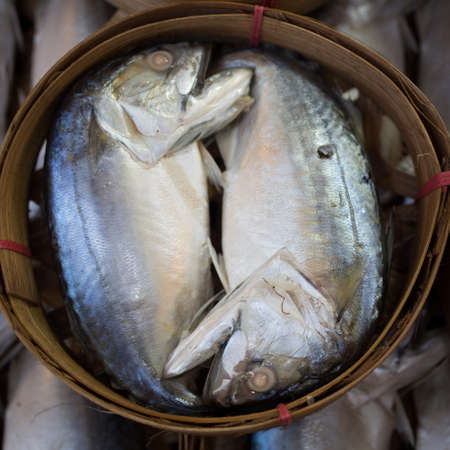 Mackerel fish in bamboo basket at market, Thailandの写真素材
