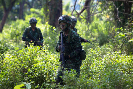 Hua Hin - December  03, 2013: Thai royal army soldier maneuver  03 december ,2013  in Pranburi , Prachuabkirikhan, THAILAND.のeditorial素材