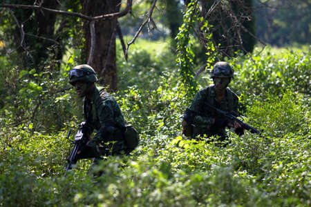 Hua Hin - December  03, 2013: Thai royal army soldier maneuver  03 december ,2013  in Pranburi , Prachuabkirikhan, THAILAND.のeditorial素材