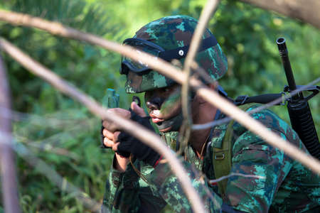Hua Hin - December  03, 2013: Thai royal army soldier maneuver  03 december ,2013  in Pranburi , Prachuabkirikhan, THAILAND.のeditorial素材