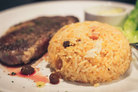 Grilled steak and fried riceの写真素材