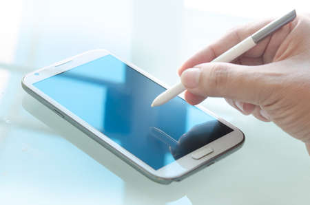 Pen and smartphoneの写真素材