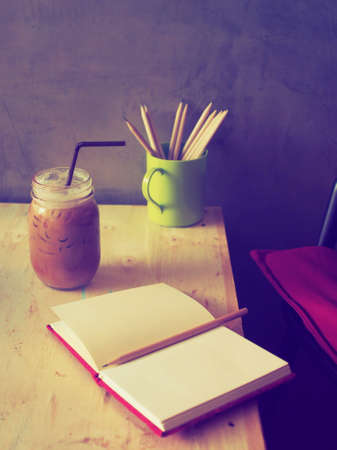 ice coffee on the wood desk  in vintage tone colorの写真素材