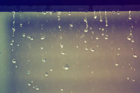raining on the floor in vintage grain film tone styleの写真素材