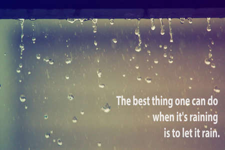 inspiration text on raining on the floor in vintage grain film tone styleのeditorial素材
