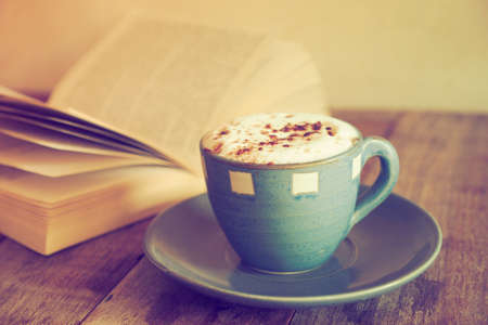 cup of coffee with book  in coffee shop vintage colorの写真素材