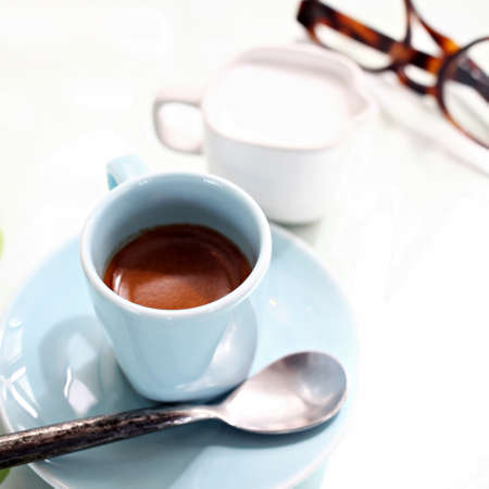 cup of coffee on the desk in coffee shopの写真素材