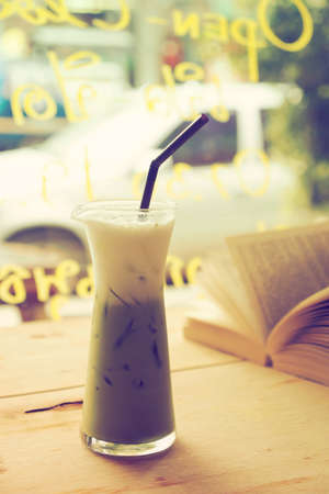 ice  green tea on the wood desk  in vintage tone colorの写真素材