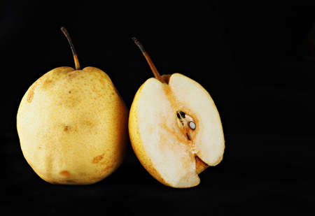 Fresh oriental pear on a black backgroundの写真素材