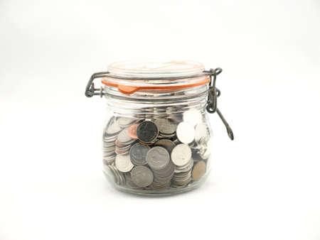 money in bottle on white の写真素材