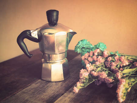 Italian coffee maker and flower vintage color style tonedの写真素材