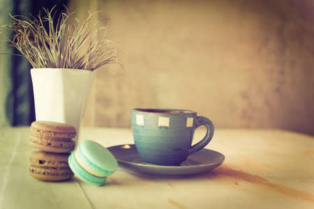 cup of coffee in coffee shop vintage color toneの写真素材