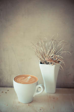 cup of coffee in coffee shop vintage color toneの写真素材