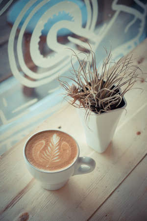 cup of coffee in coffee shop vintage color toneの写真素材