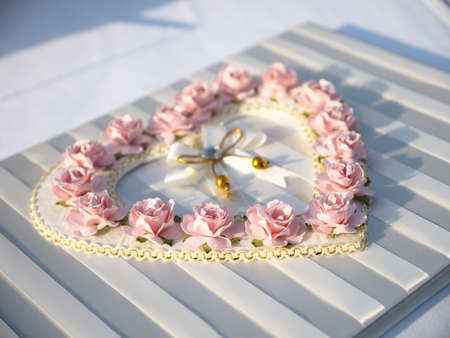 pink rose on the wedding book in wedding dayの写真素材