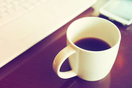 vintage color tone of  cup of coffee  on the table coffee shopの写真素材