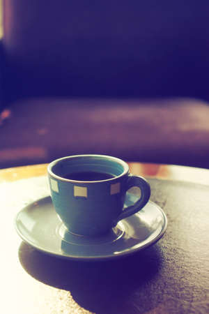 vintage color tone of  cup of coffee  on the table coffee shopの写真素材