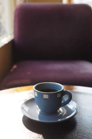 vintage color tone of  cup of coffee  on the table coffee shopの写真素材