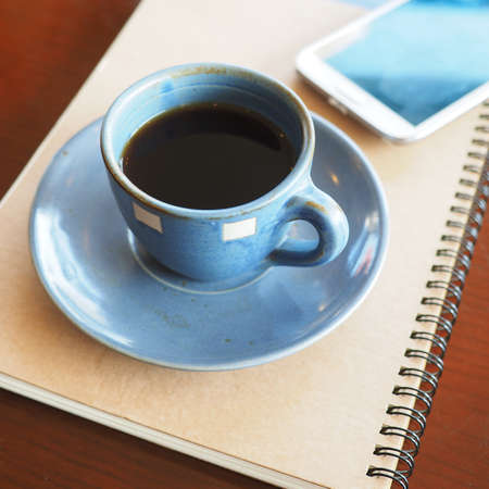 vintage color tone of  cup of coffee  on the table coffee shopの写真素材